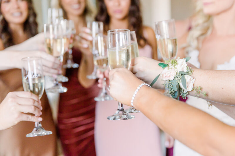 Bridesmaids toasting with champagne glasses.